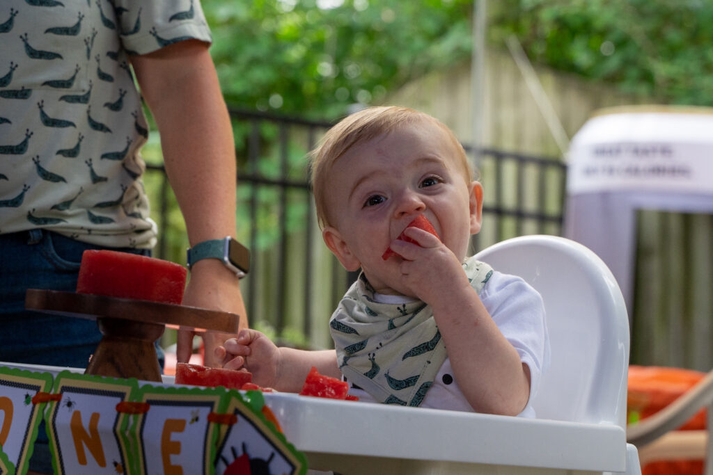 candid photos kid eating watermelon