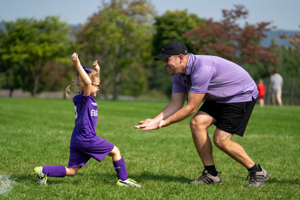 high fiving emotion sports photos